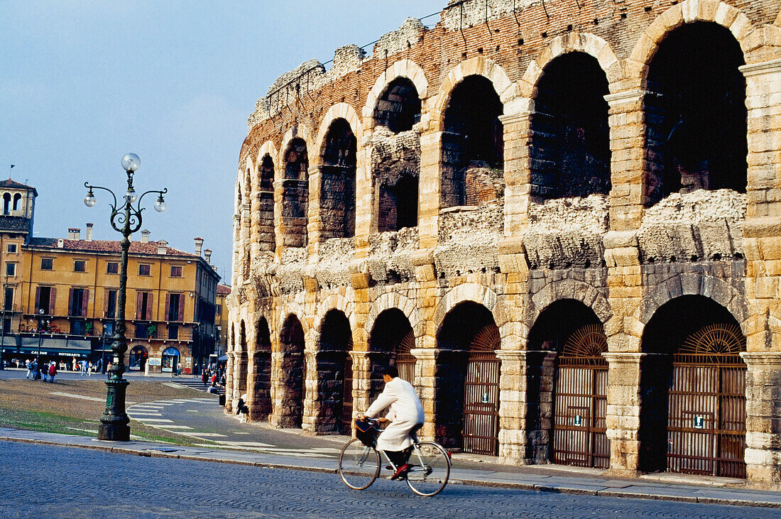 Bicycle Rider In Front Of The Arena