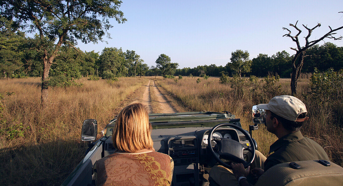 Tourist And Driver On Jeep Safari In Bandhavgarh National Park.