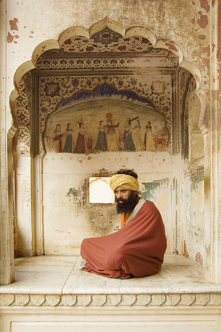 Sadhu With Beard And Turban Sitting Under Archway