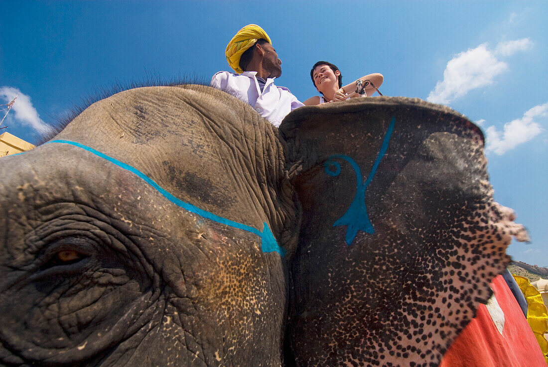 Mahout And Tourist On Elephant At Amber Fort