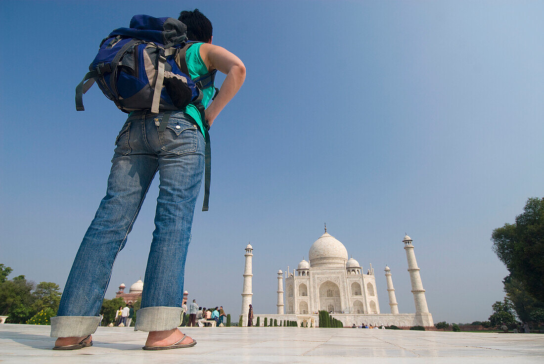Woman With Rucksack In Front Of The Taj Mahal, Low Angle View