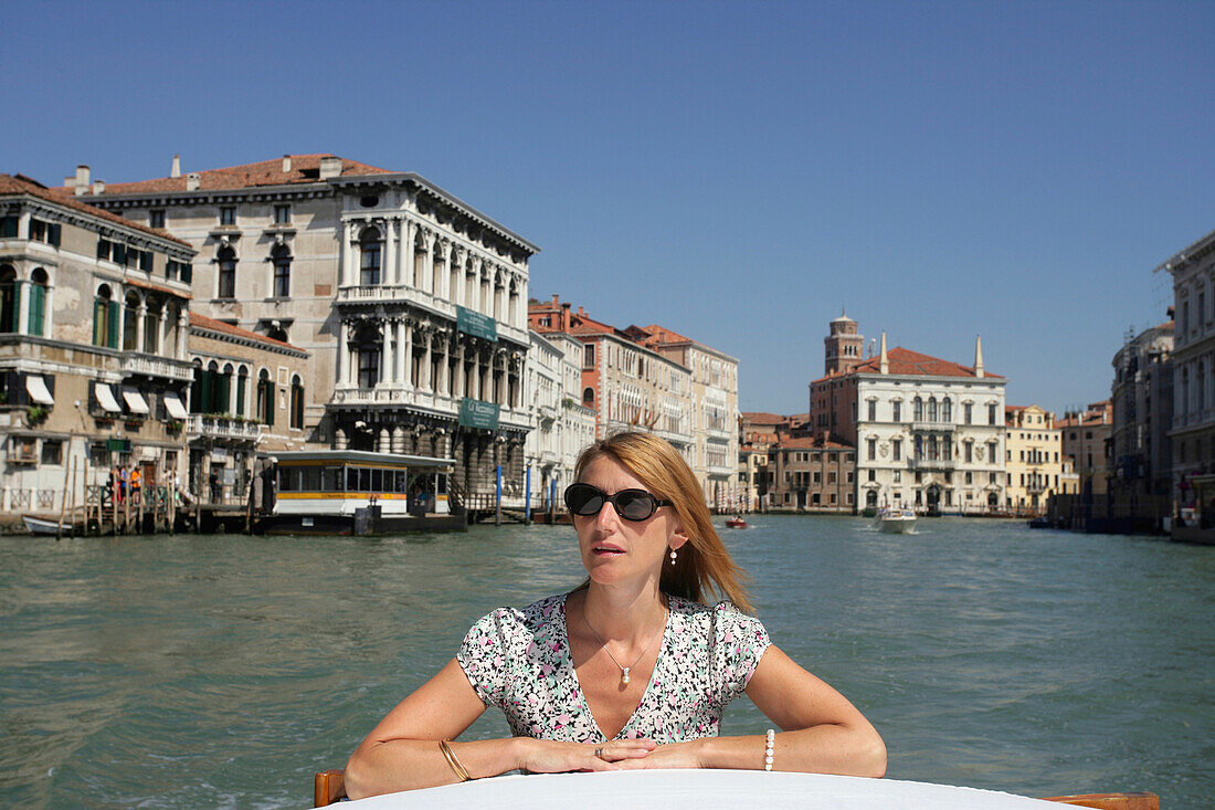 Woman Riding On A Water Taxi In Venice, Grand Canal