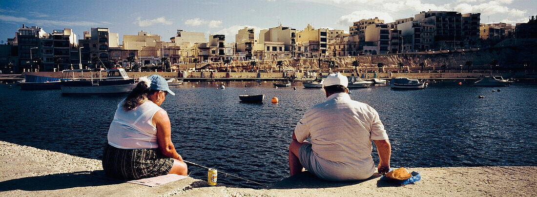 Couple Fishing By City