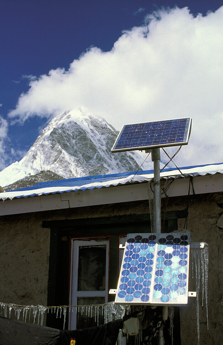 Solar Panels On Buildings And Ama Dablam Peak
