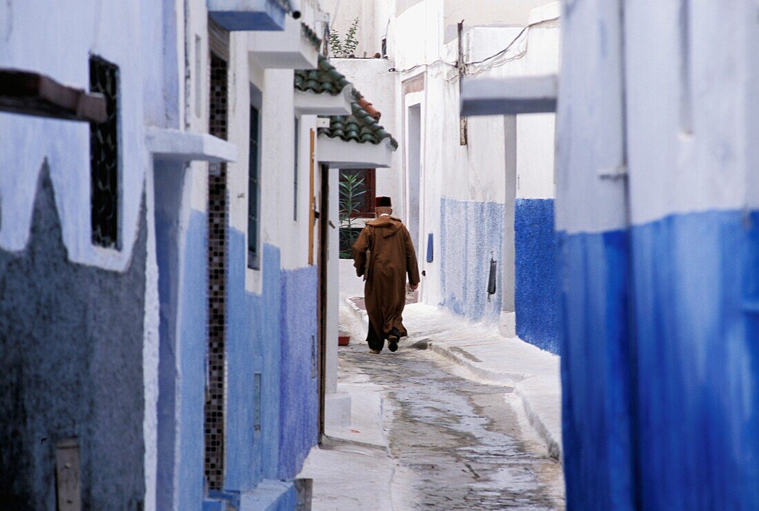 Man Walking Down Street