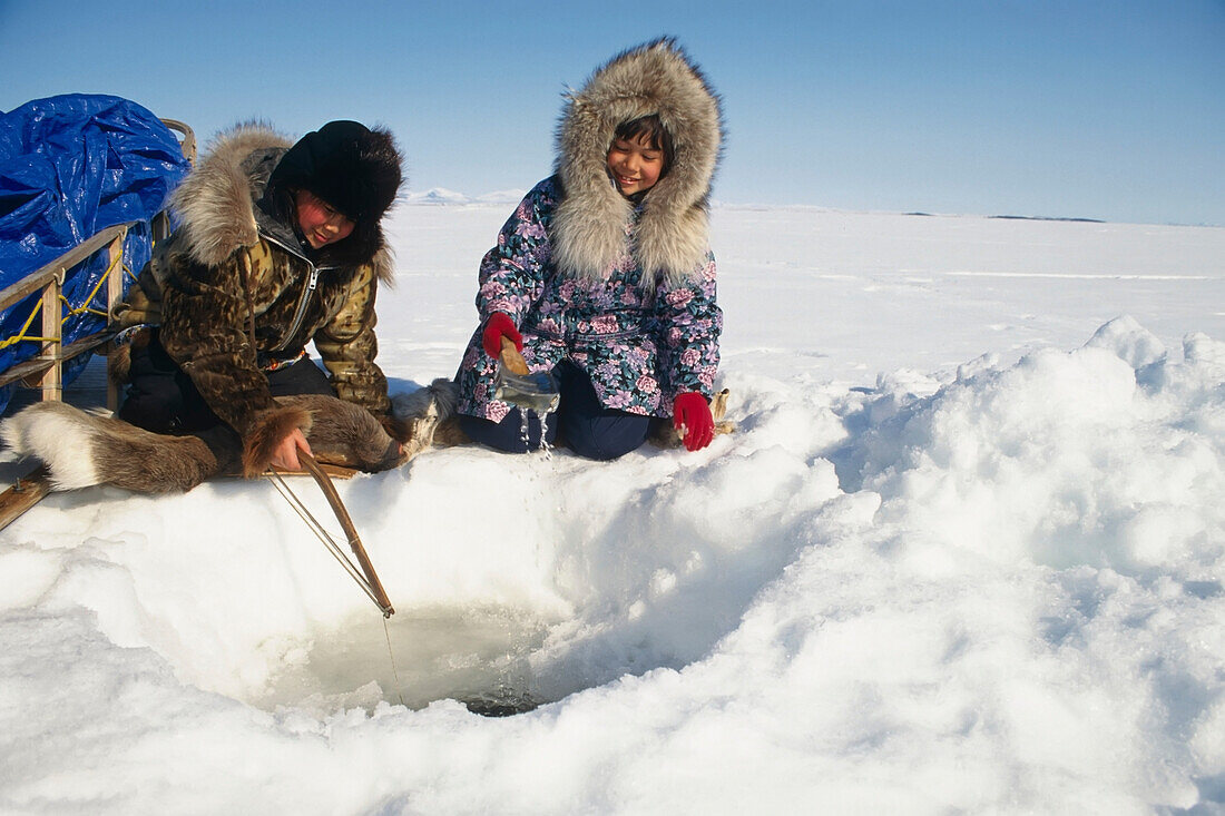 Natives Ice Fishing In Kotzebue Western Alaska Winter