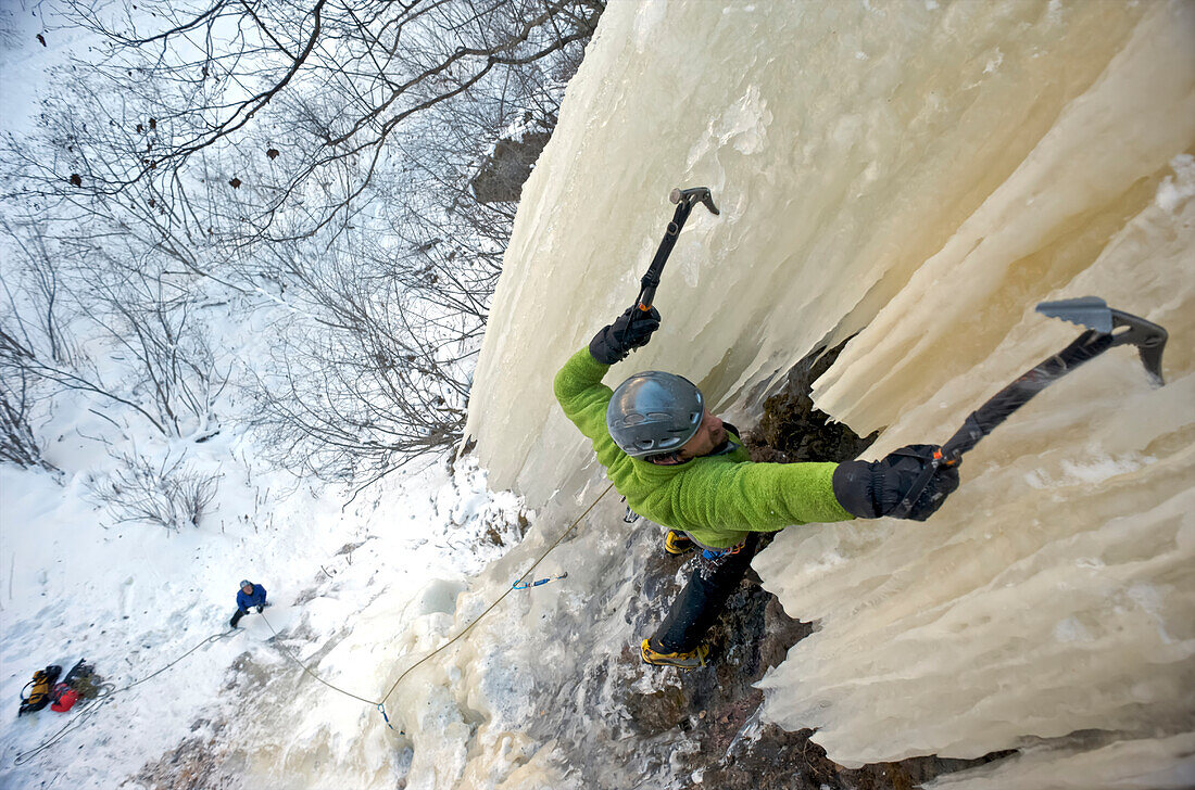 Ice Climber Ascends A Large Icefall (Route Tj Swan) In Eklutna Canyon, Southcentral Alaska