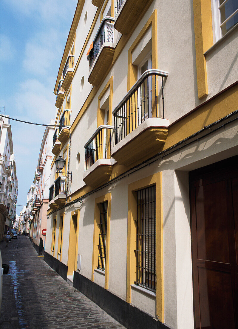 Houses With Balconies In Empty Street