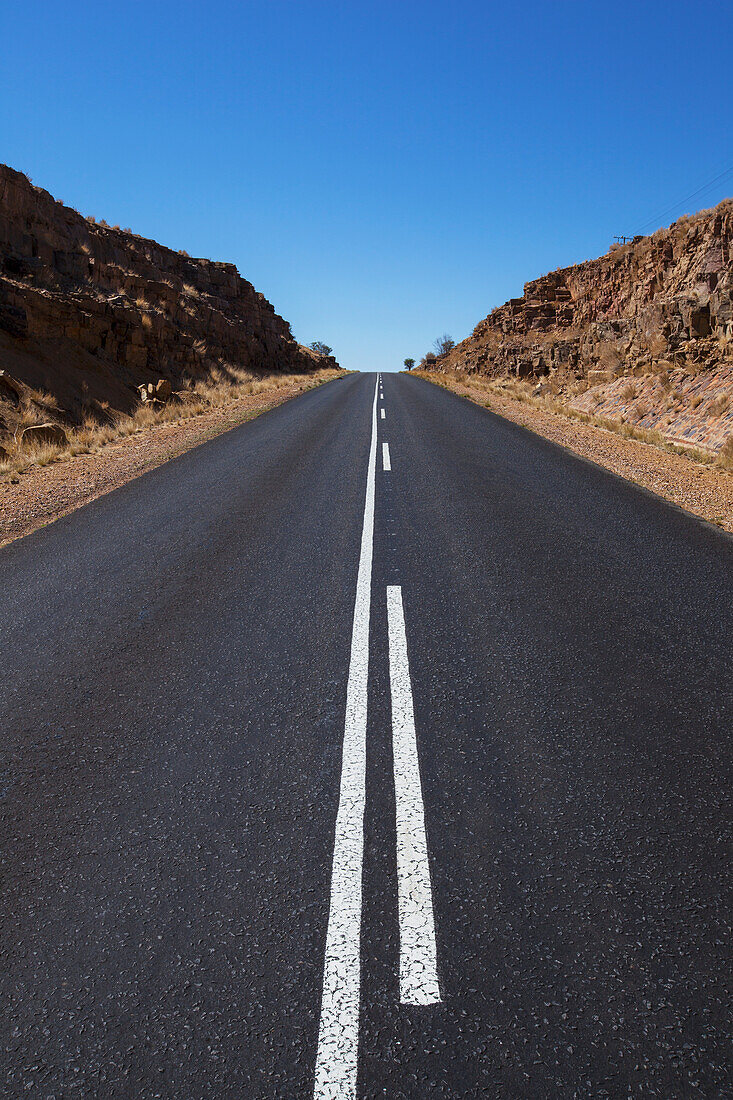 A road with a blue sky; Klein-aus namibia