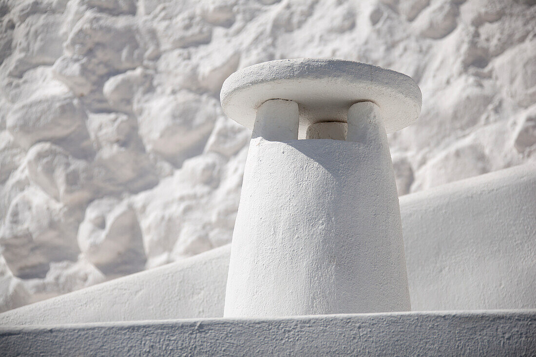 White-on-white cycladic chimney on santorini island; Imerovigli cyclades greece