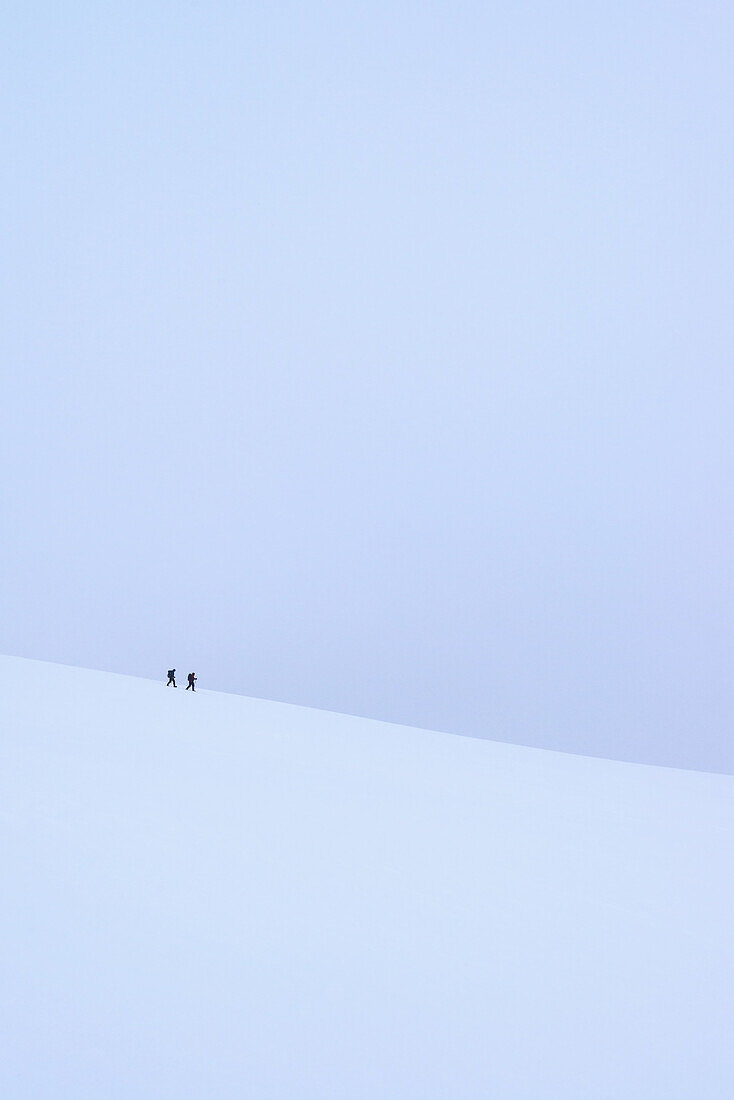 Two People Walking Along Ridge In Snow Covered, Winter Conditions On Beinn An Dothaidh, Near Bridge Of Orchy; Argyll And Bute, Scotland