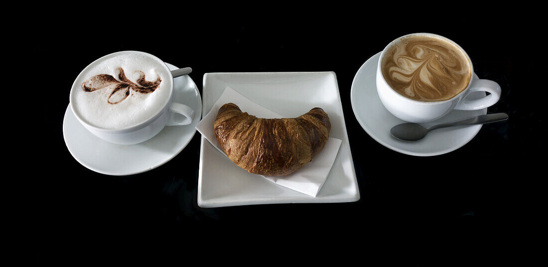 Coffee And Croissant On A Black Background