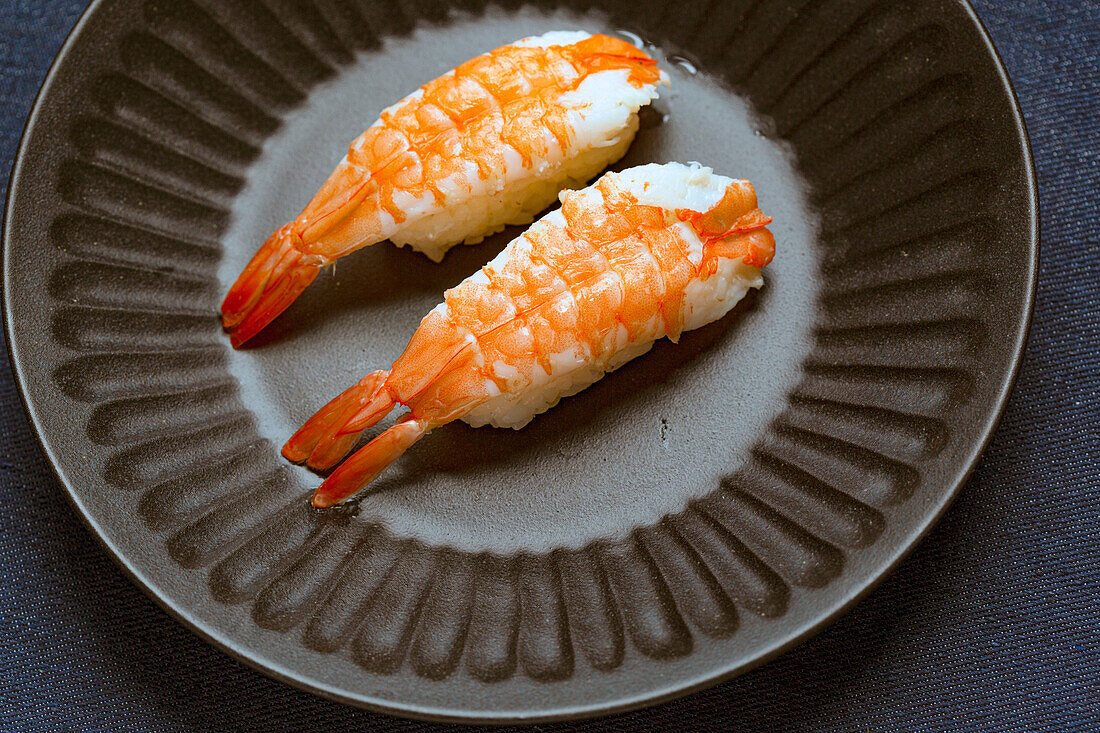 Prawns and rice on a blue dish, Japanese cuisine.