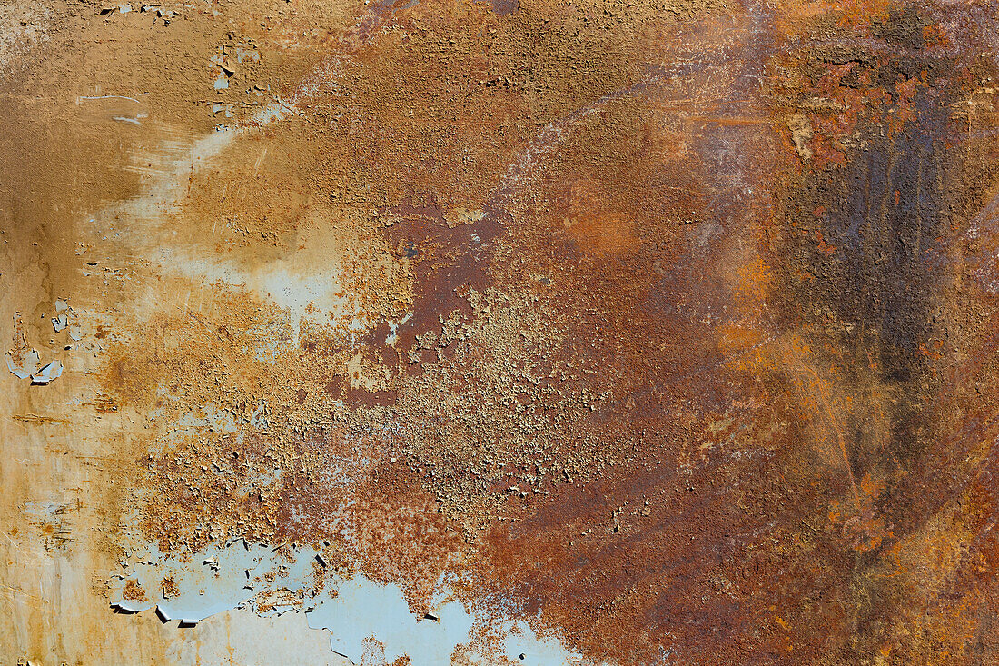 Marks and rust patterns on metal containers, close up. 