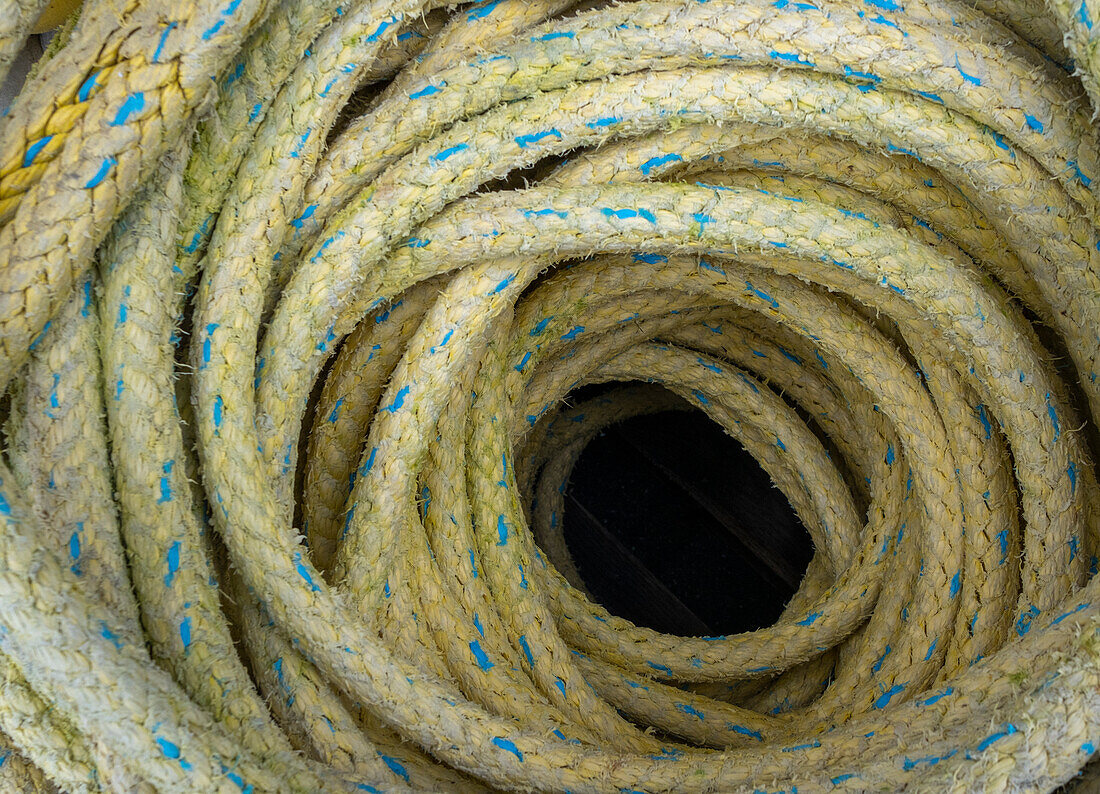 A heap of coiled industrial rope.