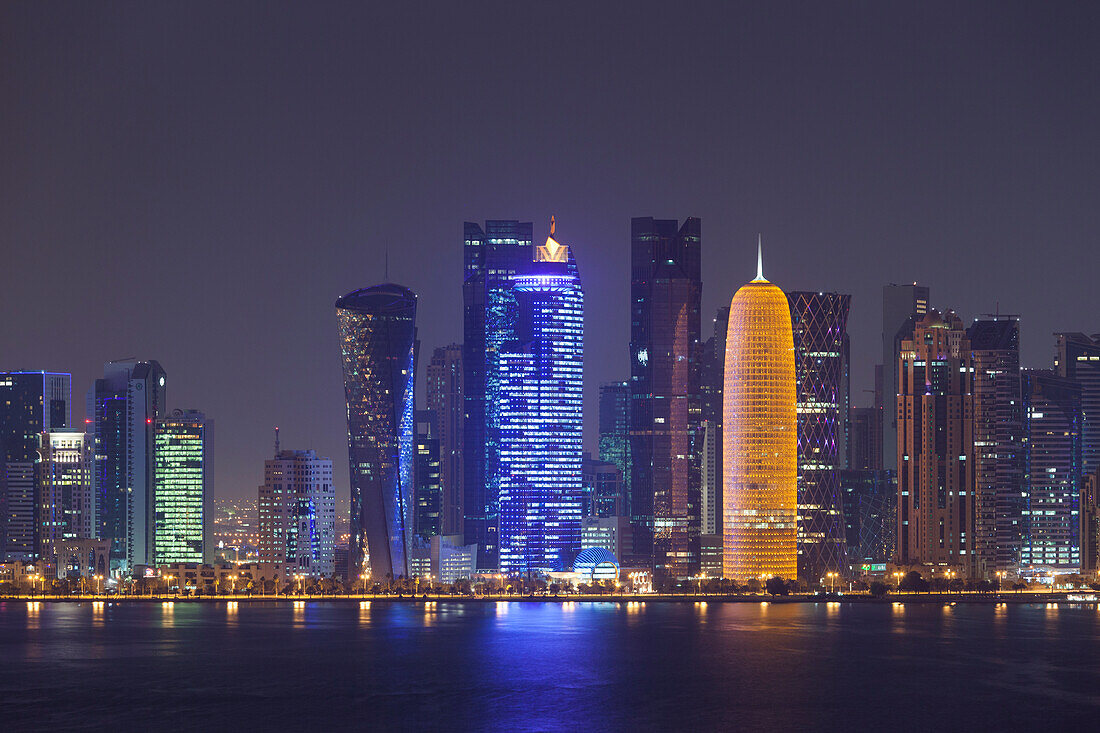 Qatar, Doha, Doha Bay, West Bay skyscrapers dawn, with World Trade Center in blue and Burj Qatar in gold