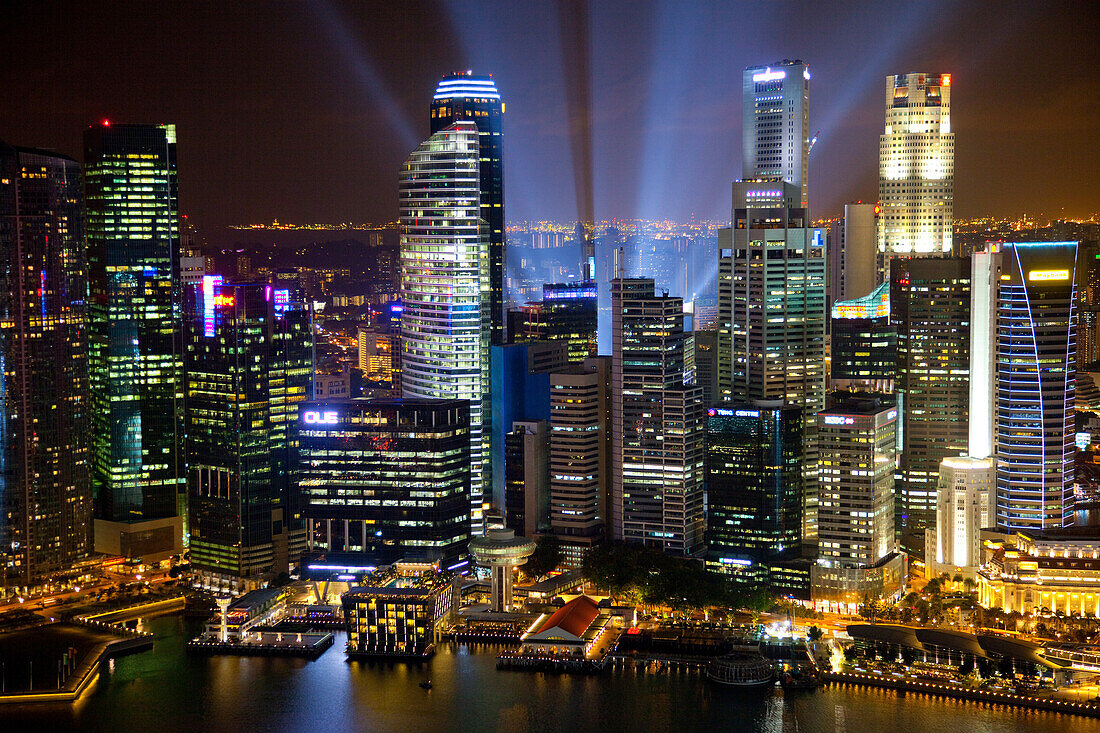 Singapore. Searchlights and city building at night.