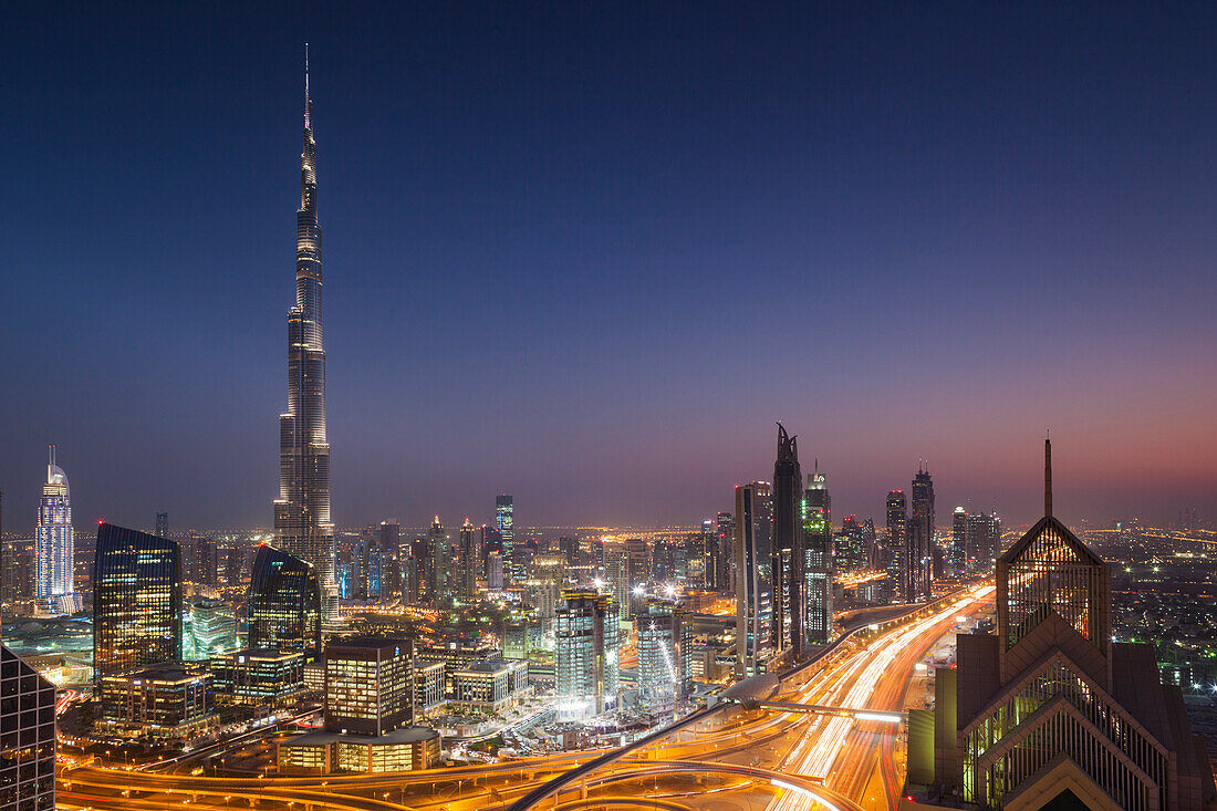 UAE, Downtown Dubai. Elevated view over Sheikh Zayed Road and Burj Khalifa Tower, world's tallest building, 2016