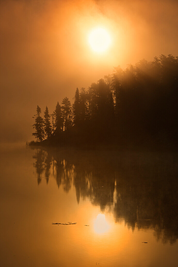 Canada, Ontario, Kenora. Isabel Lake in fog at sunrise