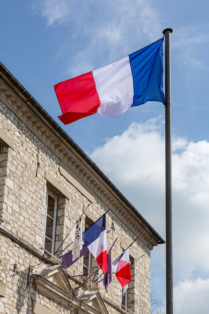 France, Giverny. Flags of France in town