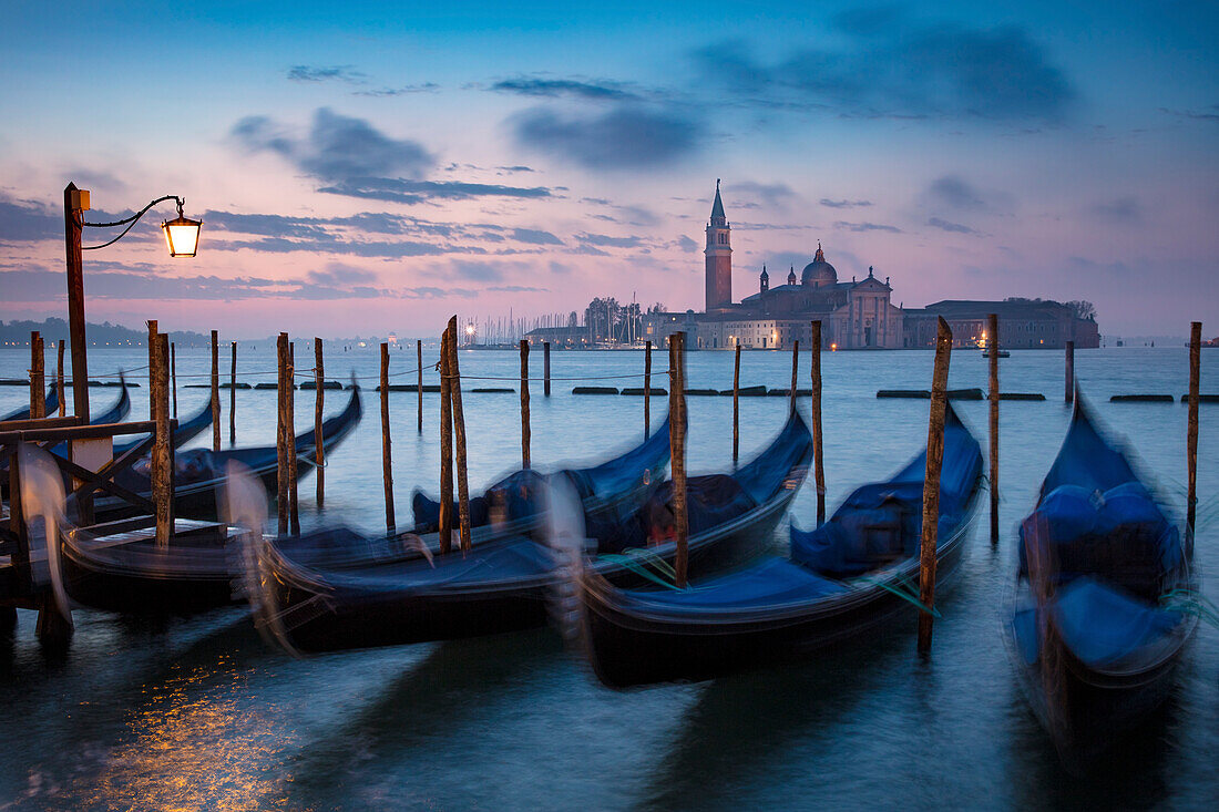 Pre-dawn light over gondolas and San Giorgio Maggiore, Venice, Veneto, Italy