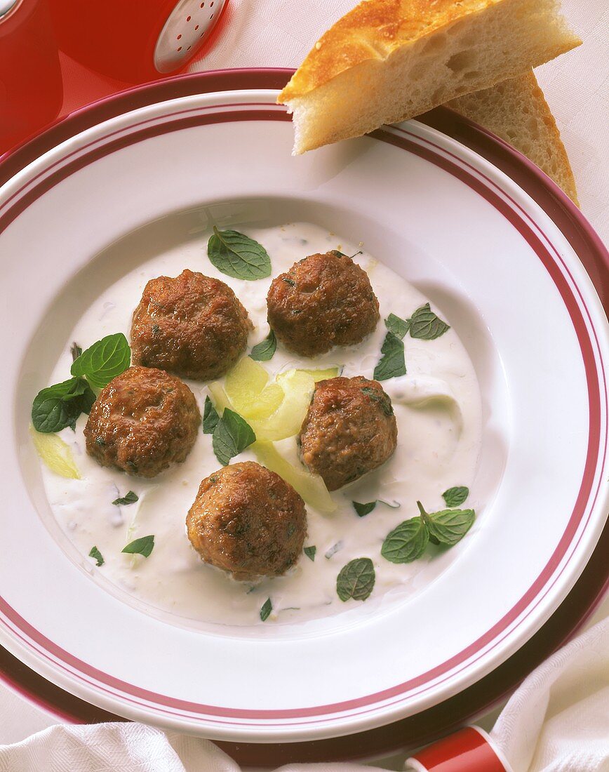 Minced lamb balls with minted yoghurt sauce