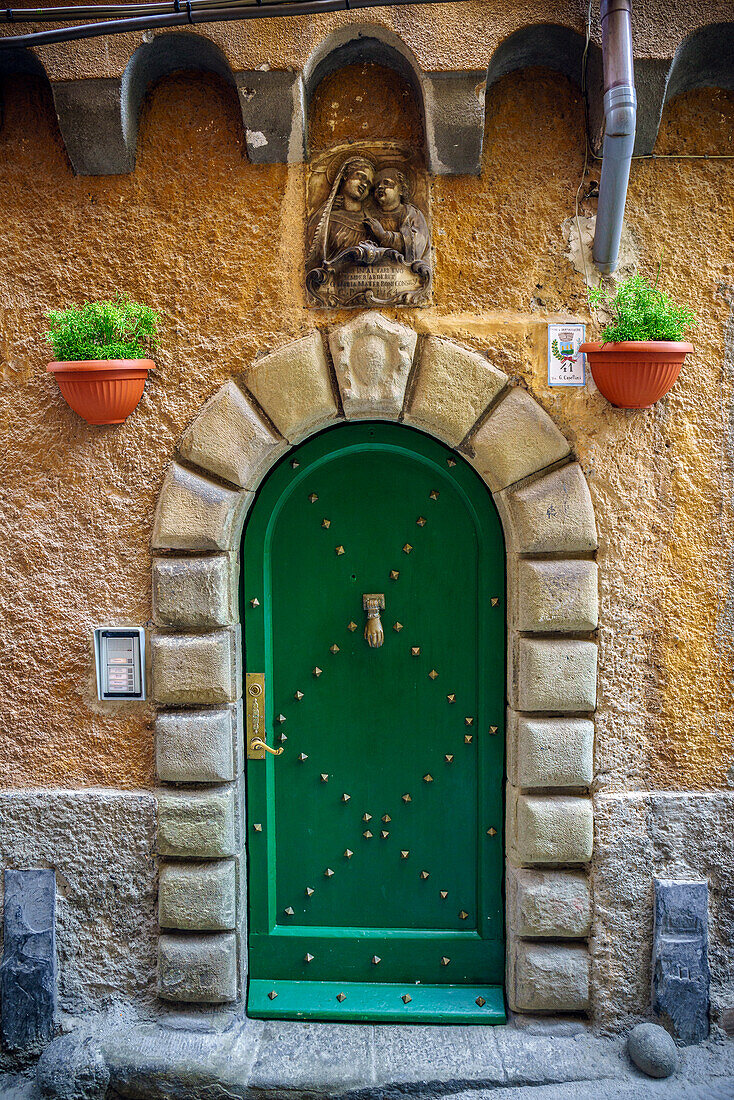 Italy, Porto Venere. Ornate house door