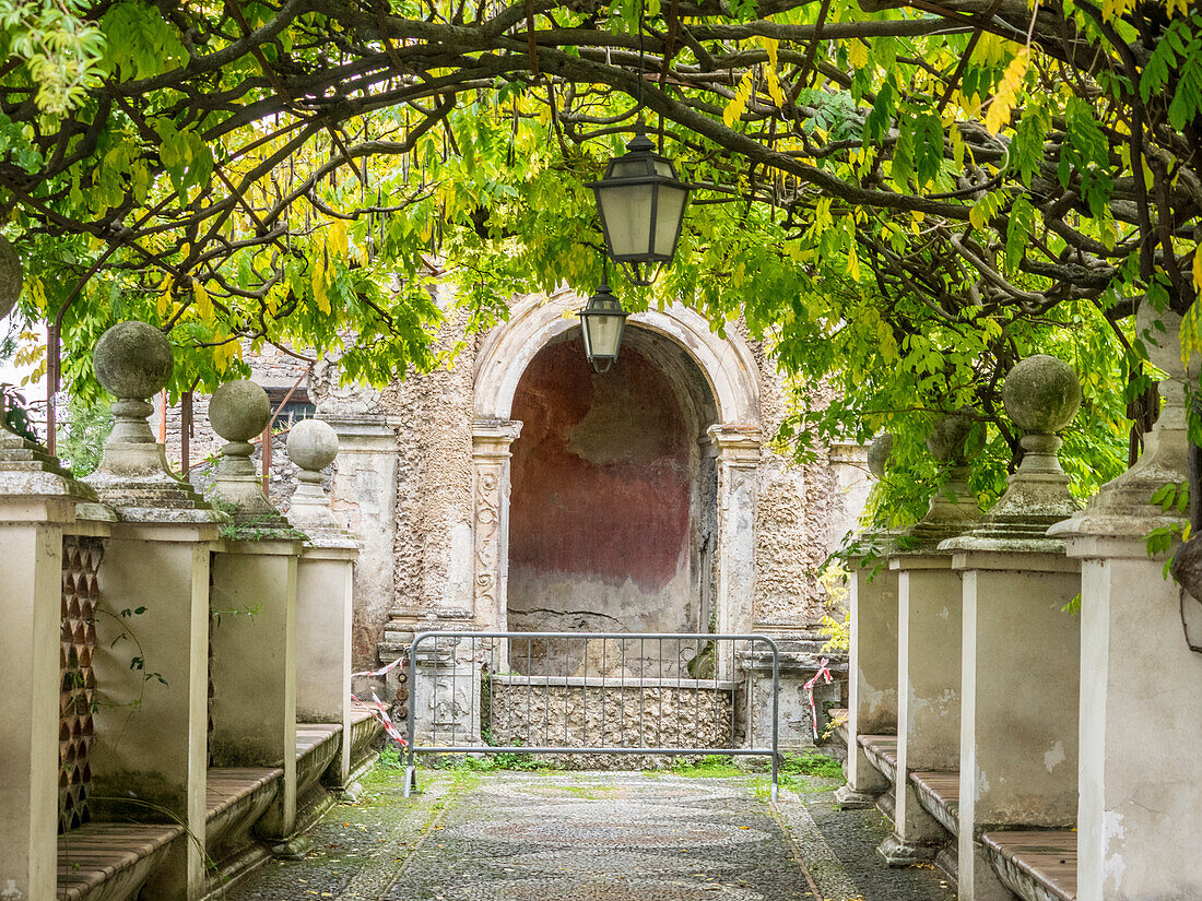 Italy, Lazio, Tivoli, Villa d'Este. Walkway in the gardens of Villa d'Este.
