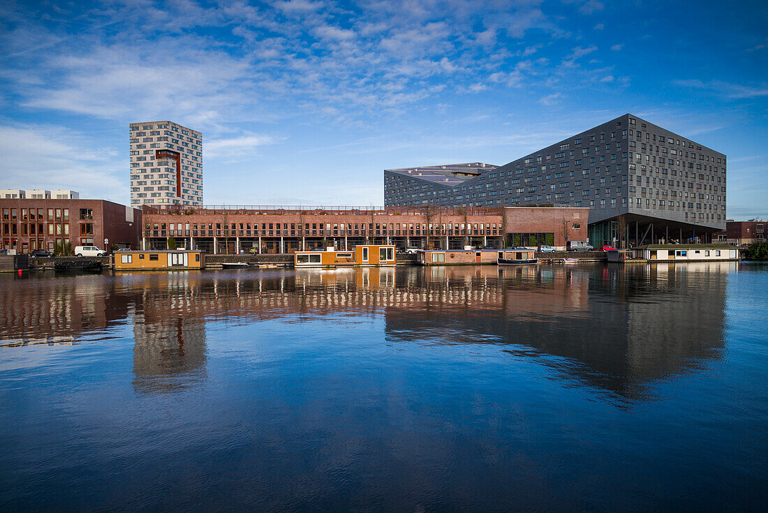 Netherlands, Amsterdam. Eastern Docklands, Spoorweg-basin with The Whale Building and renovated docklands area
