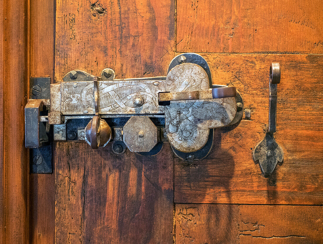 Switzerland, Bern Canton, Spiez, Spiez Castle, wood door with ornate hardware