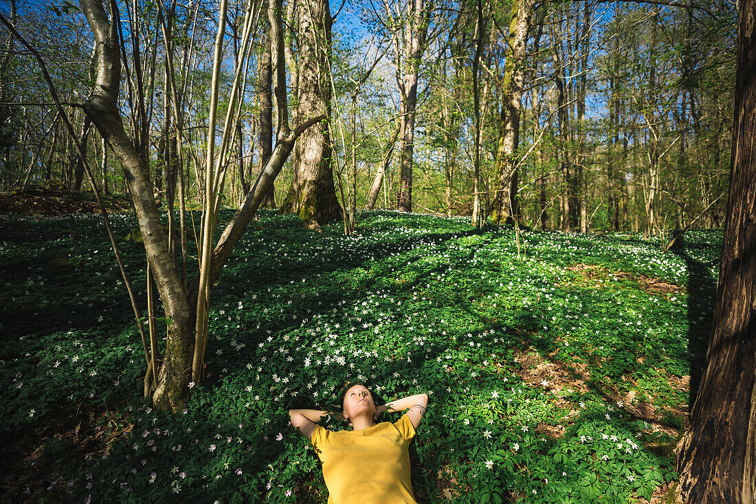 Woman relaxing in forest