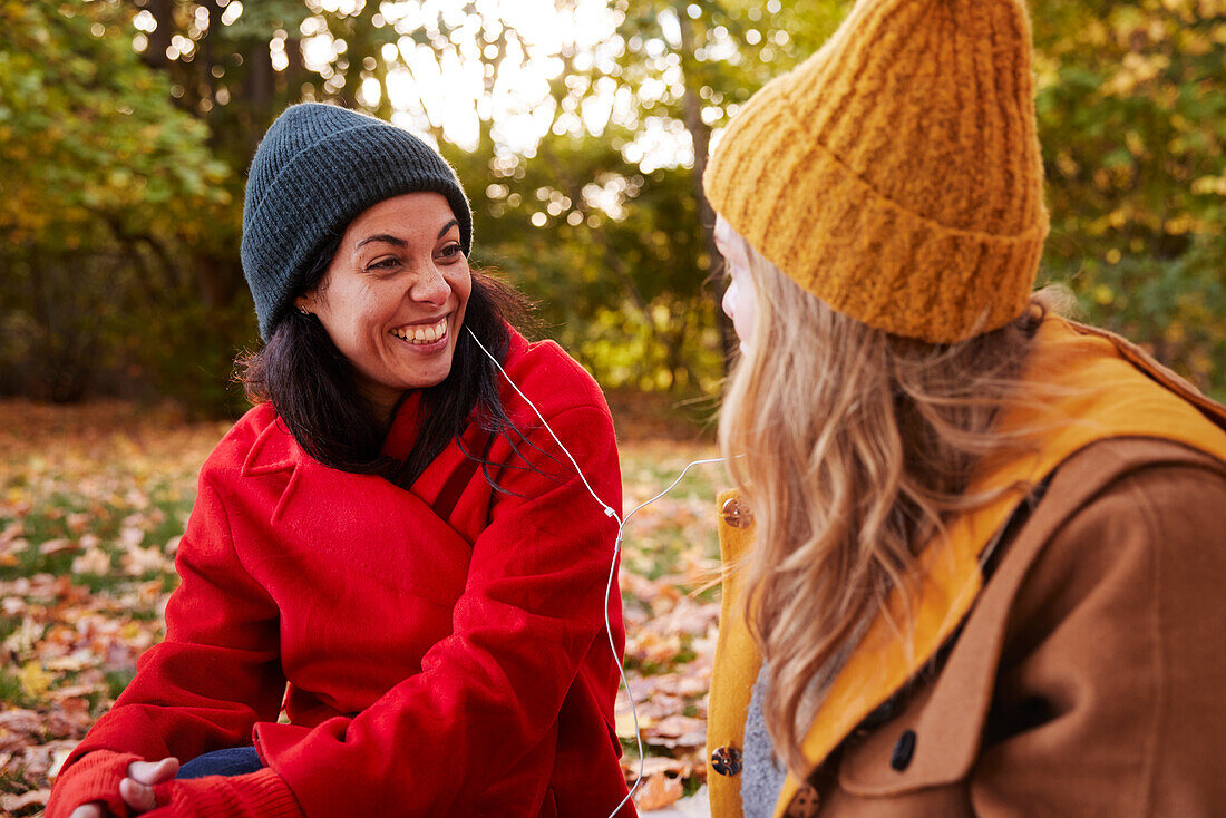 Happy friends in autumn scenery