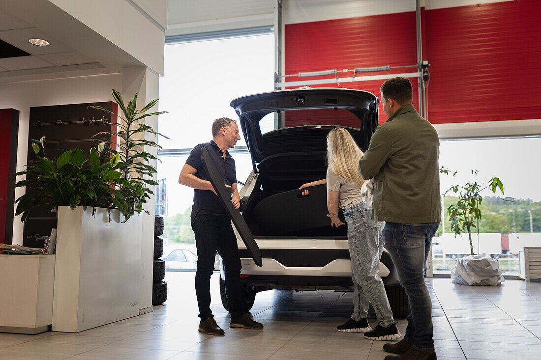 Customers in car dealership office