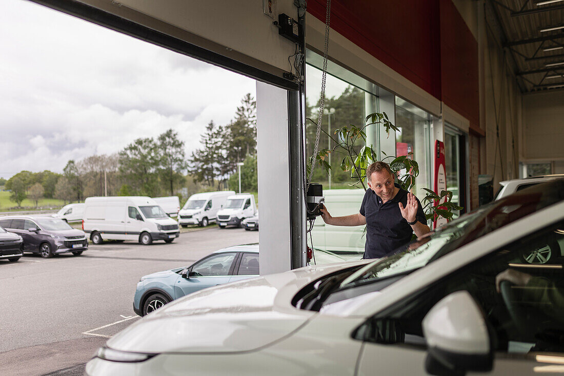 Customer leaving car dealership office