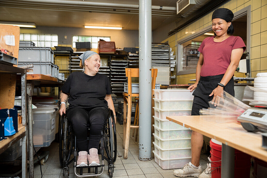 Disabled woman working in food factory