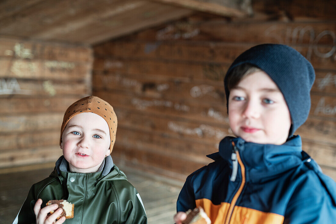 Portrait of boys eating cake