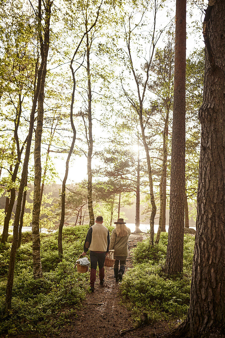 Couple walking through forest