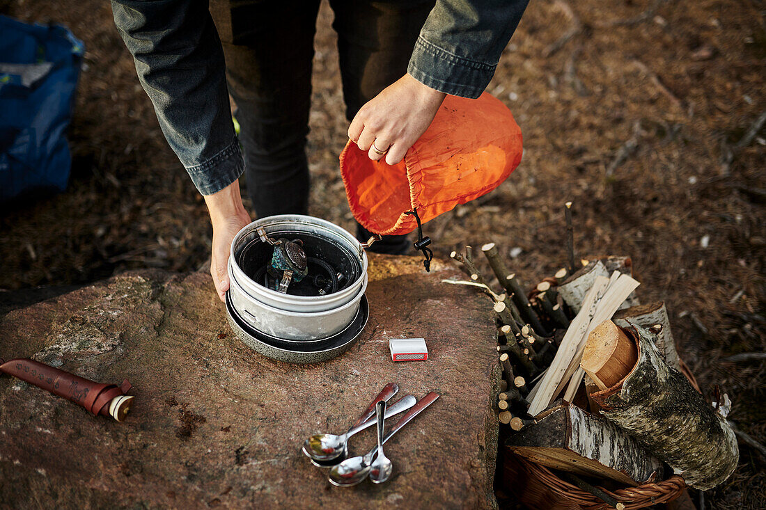 Person preparing camping stove