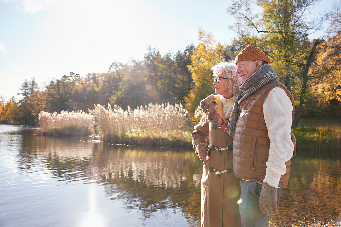 Senior couple next to lake in park