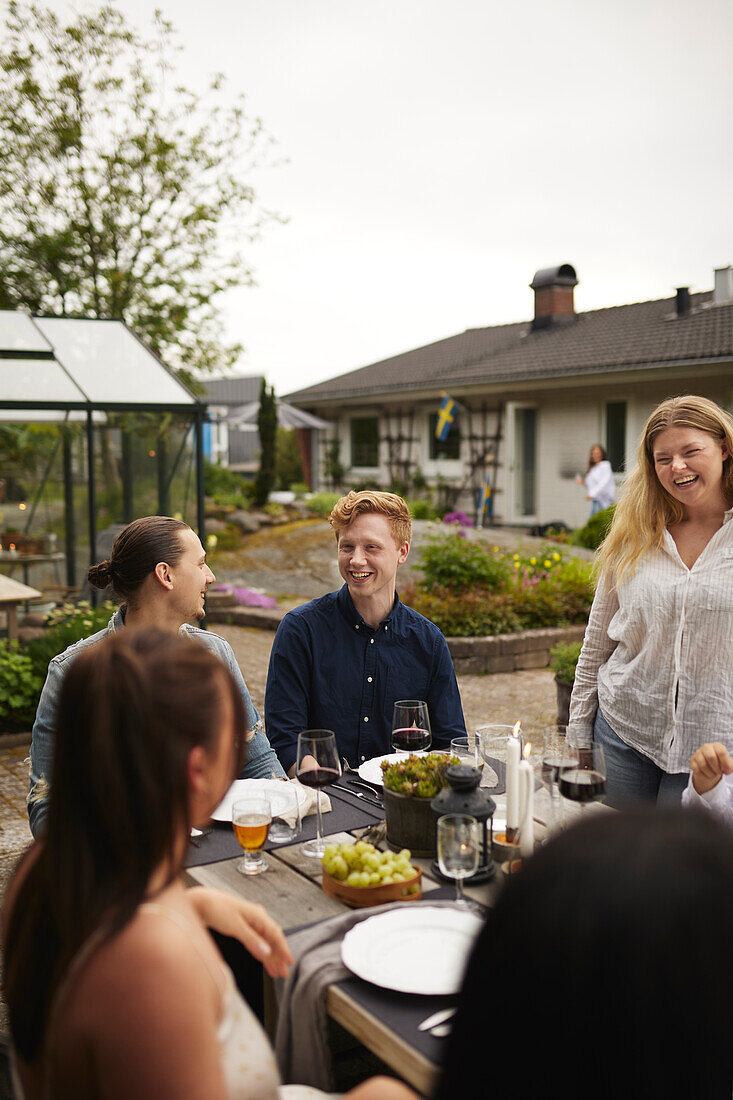 Friends having meal in garden