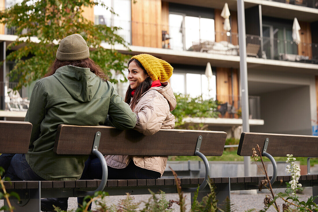 Man and woman sitting on bench