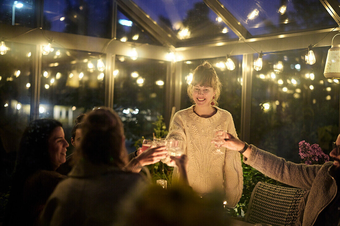 Friends having evening meal together