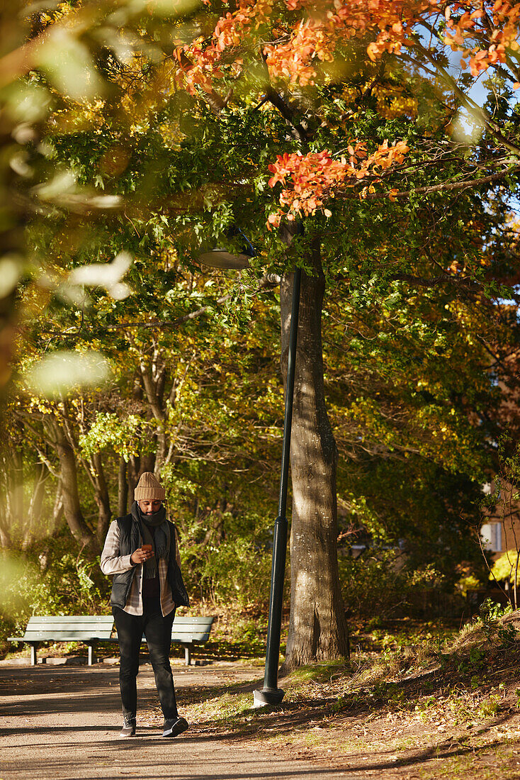 Man standing in autumn park