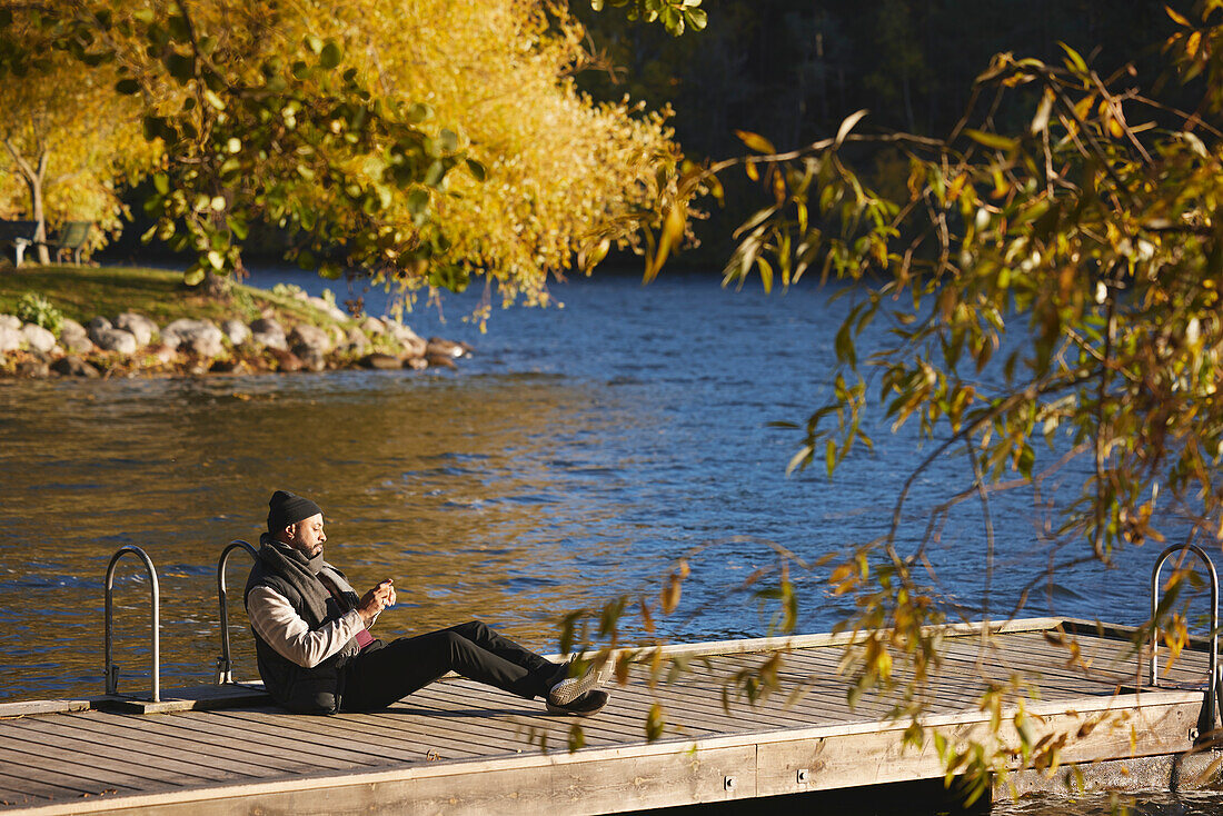 Man relaxing on jetty