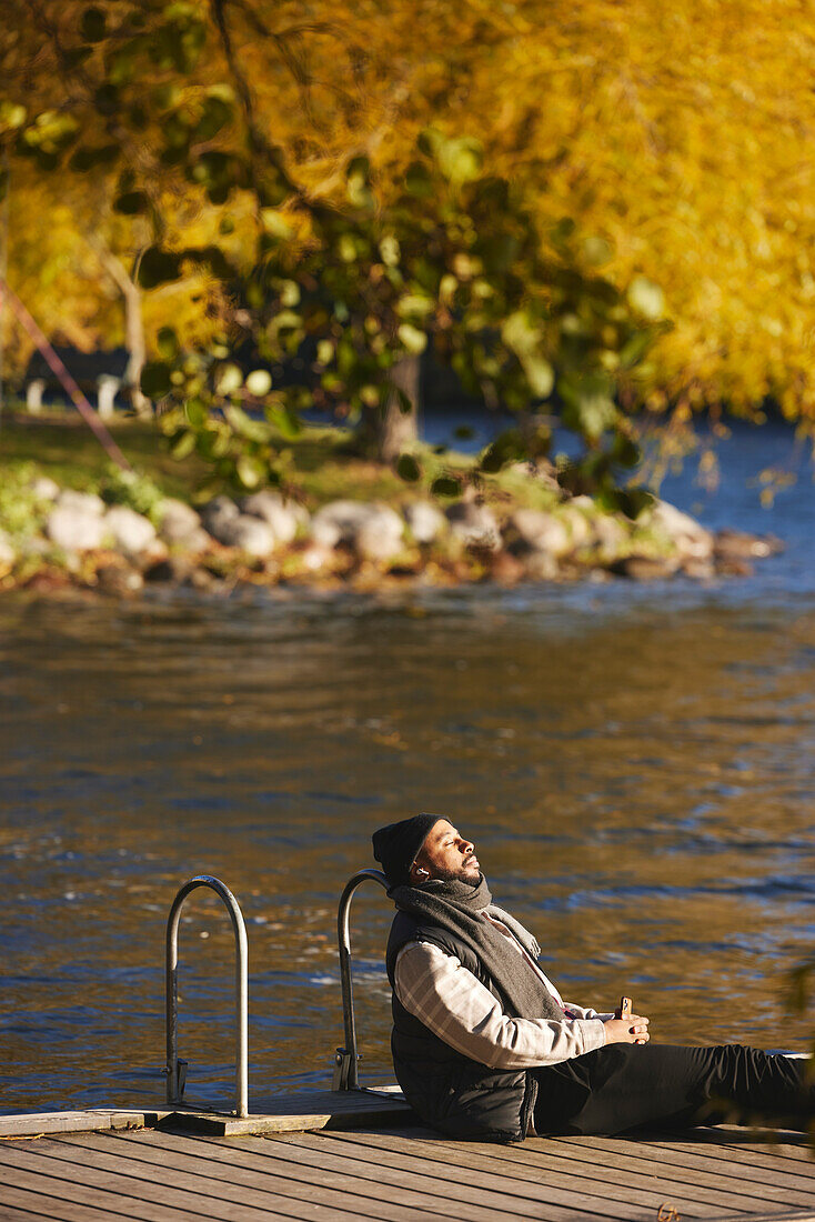 Man relaxing on jetty