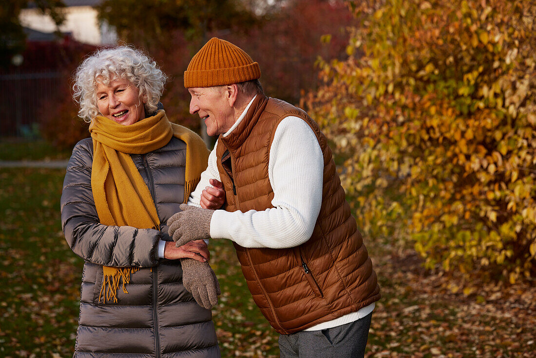 Senior couple in autumn scenery