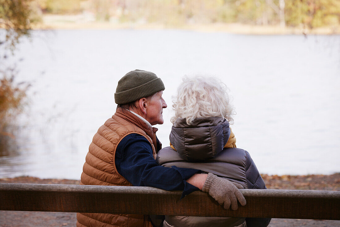 Senior couple resting at lakeside