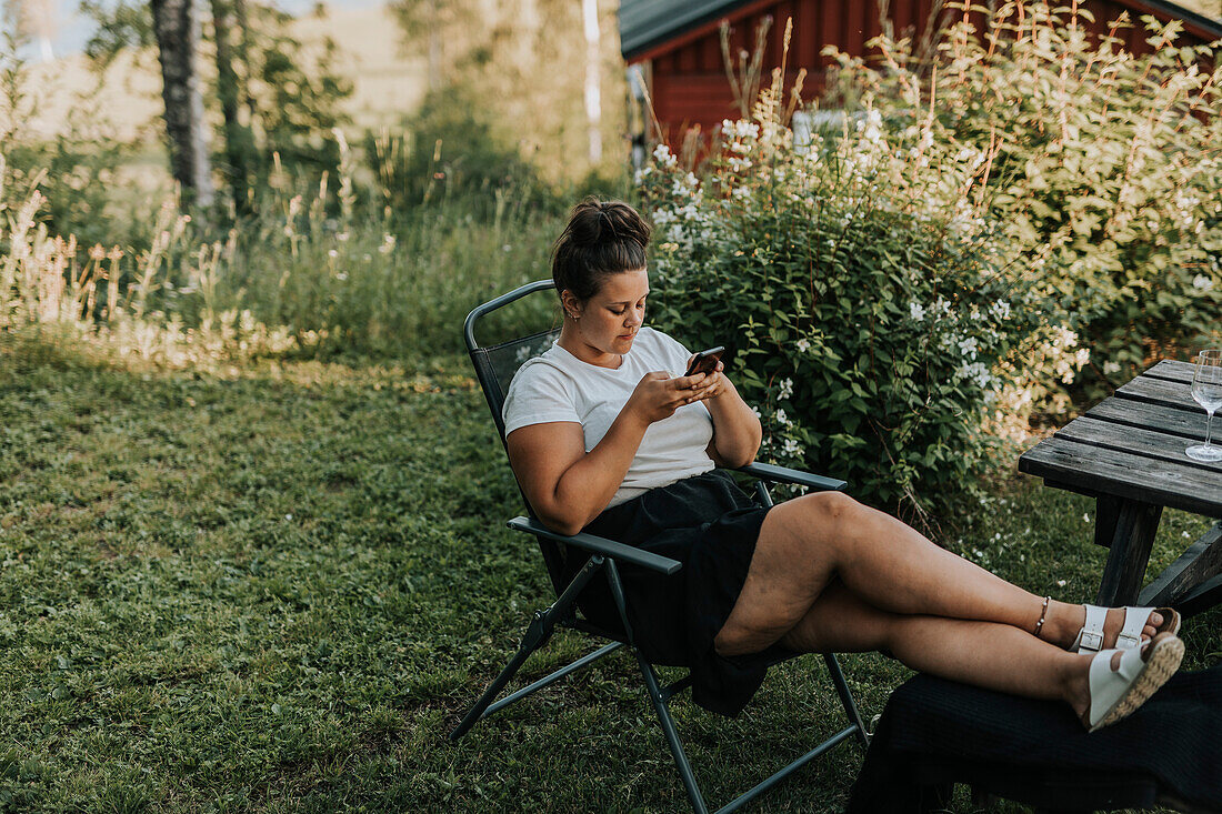 Young woman using cell phone