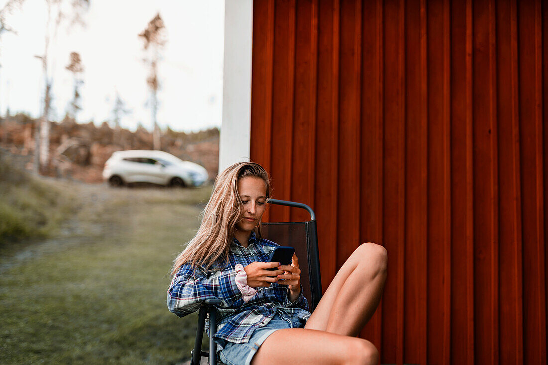 Young woman using cell phone