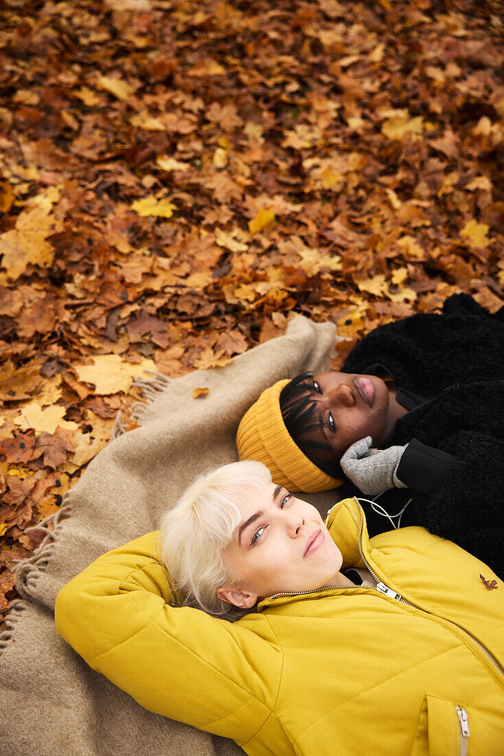 Female friends lying together